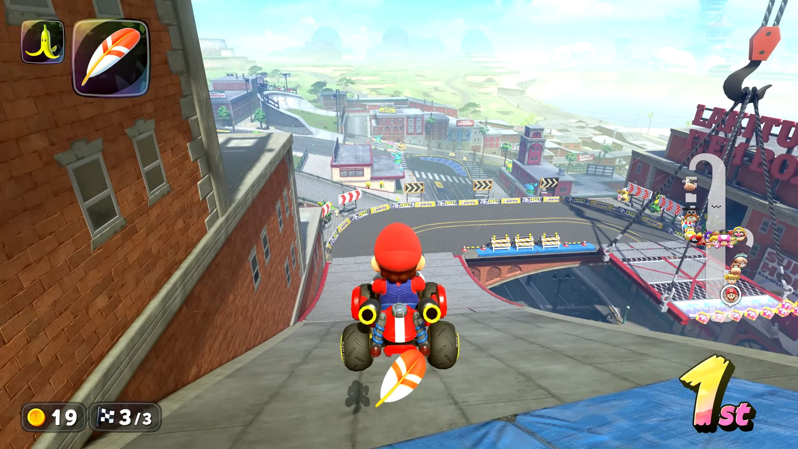 Items will now automatically assume a defensive position behind your kart in Mario Kart World, such as the feather in this example.