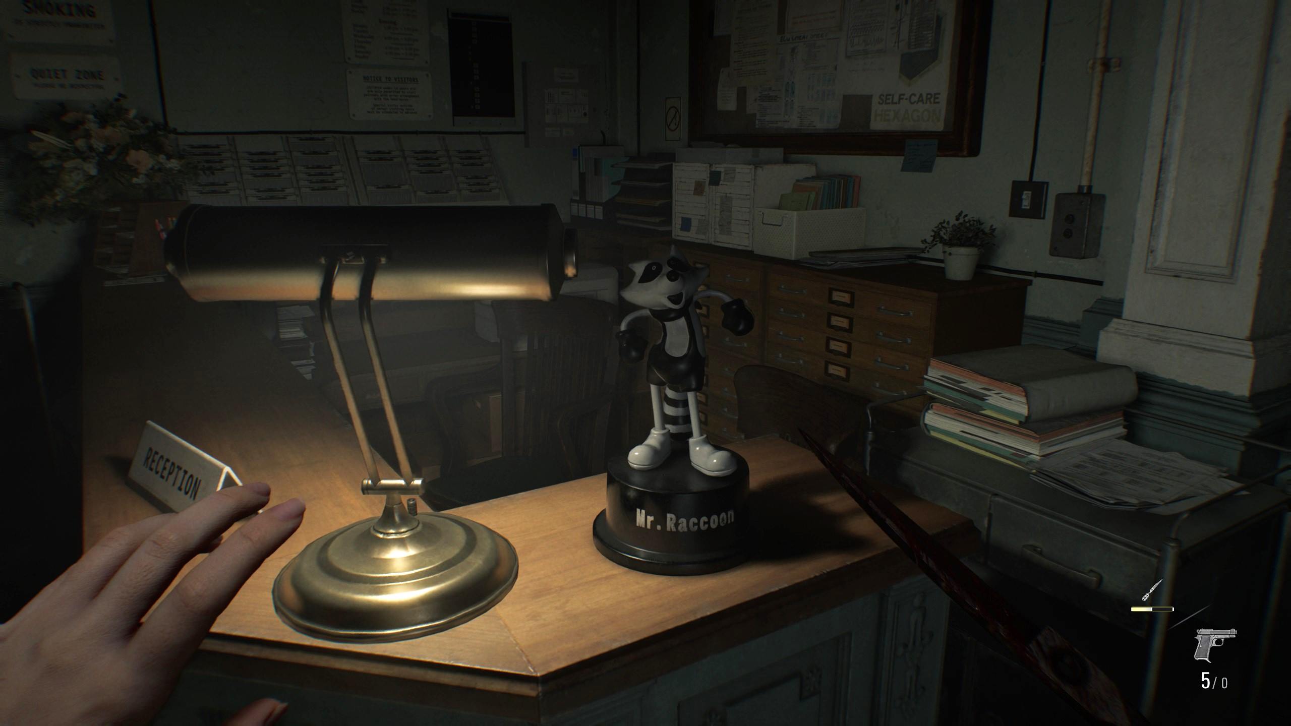 A Mr. Raccoon figure greeting Grace at the East Wing reception of the care center.