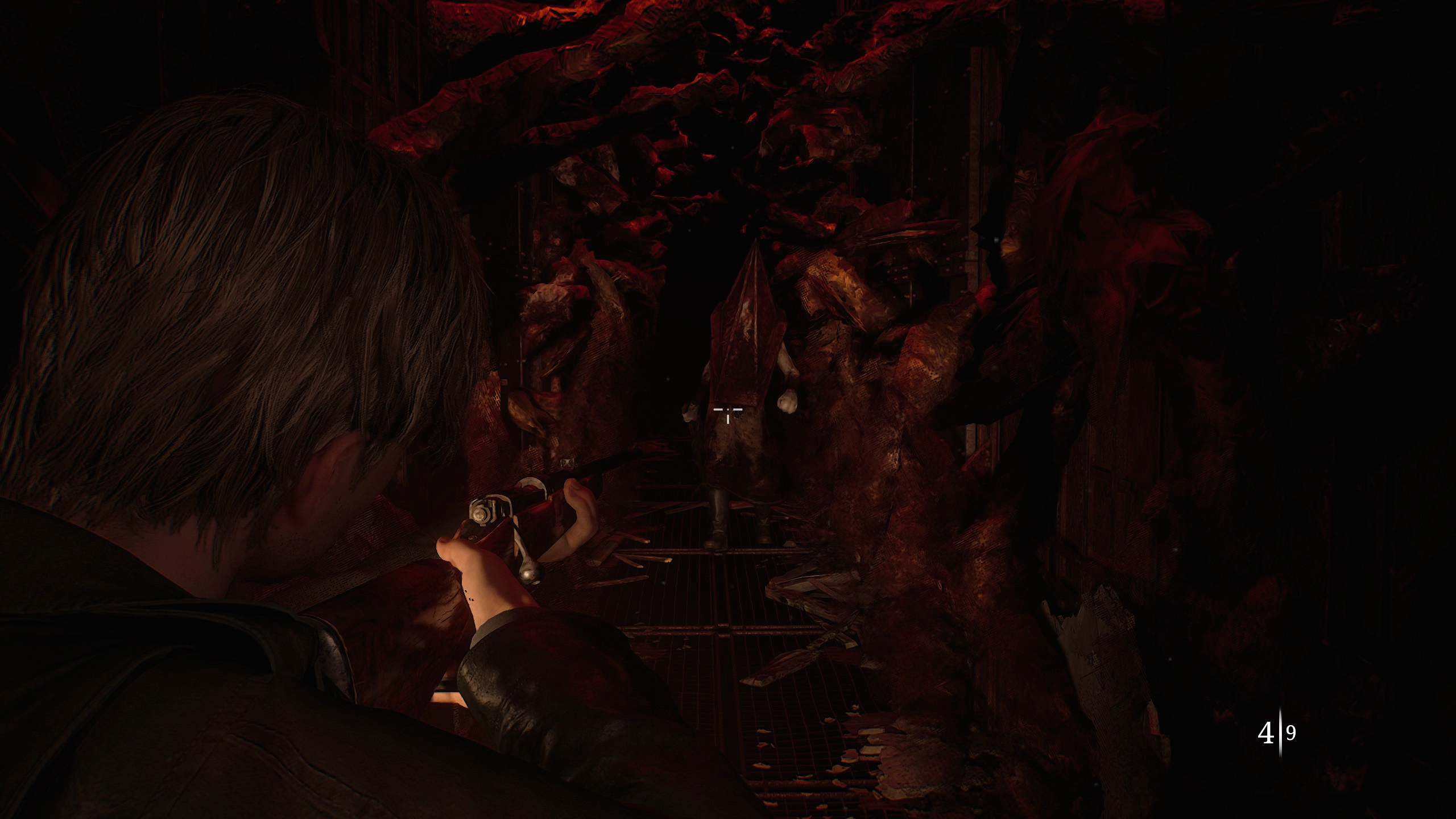 James aiming his gun at Pyramid Head, the monster in his way but also helping clear the way